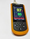 Close up handheld pulse oximeter medical instruments used to monitoring blood oxygen in patients in emergency room in hospital.