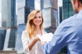 Close-up of handing over documents during business briefing