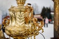 Close-up handle. Large metal gold old traditional Russian samovar for tea drinking. Royalty Free Stock Photo