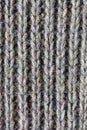 Close up of handmade knitted wool sweater/wool texture background with shades of grey Royalty Free Stock Photo