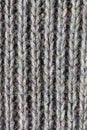 Close up of handmade knitted wool sweater/wool texture background with shades of grey