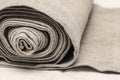 Close up of handmaiden textile canvas in the roll. Homespun hemp unpainted cloth