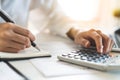 close up hands of accountant using calculator balance of company