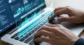 Hands typing on a laptop with glowing digital data on screen Royalty Free Stock Photo