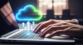 Hands typing on a laptop with a glowing neon cloud and upward arrows symbolizing cloud computing and data transfer Royalty Free Stock Photo