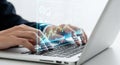 Hands typing on a laptop keyboard with glowing digital data overlay for technology and innovation concept Royalty Free Stock Photo