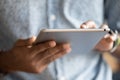 Close up hands of African man holding digital tablet device Royalty Free Stock Photo