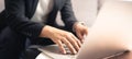 Close up hands of Asian business man using laptop computer working from home sitting on sofa, new normal  digital lifestyle, work Royalty Free Stock Photo