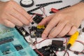Close-up of hands assembling robotics educational toy. STEM education concept Royalty Free Stock Photo