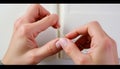 Hands assembling wooden craft sticks, DIY art project, Stock Photo, Generative AI