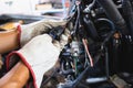 Close up hands of auto mechanic doing car service and maintenance. Car wiring with adapters and connectors changing