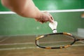Close up of hands badminton player holding shuttlecock and racket Royalty Free Stock Photo