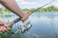 Close-up of hands of a boy with a fishing rod Royalty Free Stock Photo