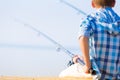 Close-up of hands of a boy with a fishing rod Royalty Free Stock Photo