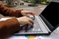 Close up hands of business man typing on laptop in park Royalty Free Stock Photo