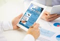 Close up of hands with business news on tablet pc Royalty Free Stock Photo