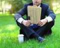 Close up of the hands of the businessman with a newspaper Royalty Free Stock Photo