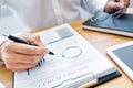 Close-up of hands Businessman reading and writing with pen signing contract over document for Completing Application Form at work Royalty Free Stock Photo