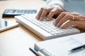 Close-up of hands Businessman reading and writing with pen signing contract over document for Completing Application Form at work Royalty Free Stock Photo