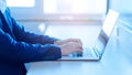 Close up hands of a businessman typing text on laptop in office, business concept Royalty Free Stock Photo