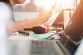 Close up hands of businessman working using smartphone and laptop on table workspace with sunlight. business working background Royalty Free Stock Photo