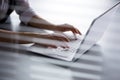 Close-up of hands of businesswoman typing on a laptop. Royalty Free Stock Photo