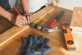 Close up hands of carpenter marking on wood for build craft stuff . Royalty Free Stock Photo