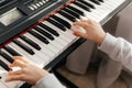 Close up hands of caucasian girl playing synthesizer. Royalty Free Stock Photo