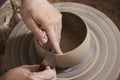 Close-up of the hands of a ceramist working in his potter wheel. Royalty Free Stock Photo