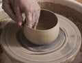 Close-up of the hands of a ceramist working in his potter wheel Royalty Free Stock Photo