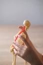 Close-up of hands of child examining plastic model of human skeleton, an anatomical manual for children, the concept of studying