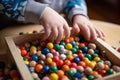 close-up of the hands of a child playing with multi-colored sensory balls generative ai