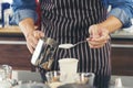 Close up hands coffee barista man make hot cup espresso shot from coffee machine. Cappuccino with milk in italian coffee shop cafe Royalty Free Stock Photo