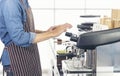 Close up hands coffee barista man make hot cup espresso shot from coffee machine. Cappuccino with milk in italian coffee shop cafe Royalty Free Stock Photo