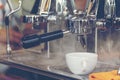 Close up hands coffee barista man make hot cup espresso shot from coffee machine. Cappuccino with milk in italian coffee shop cafe Royalty Free Stock Photo