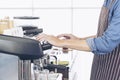 Close up hands coffee barista man make hot cup espresso shot from coffee machine. Cappuccino with milk in italian coffee shop cafe Royalty Free Stock Photo