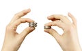 Close up. Hands compare two piles of coins of different sizes, i Royalty Free Stock Photo