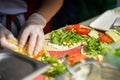 Close-up of hands of cook in gloves preparing fajitas, tortilla. Healthy fresh food. Concept national food, healthy fast