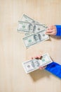 Close-up of hands counting money. Happy child with money dollar, little businessman. Pile of United States dollar hundred USD Royalty Free Stock Photo