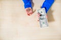 Close-up of hands counting money. Happy child with money dollar, little businessman. Pile of United States dollar hundred USD Royalty Free Stock Photo