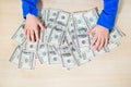 Close-up of hands counting money. Happy child with money dollar, little businessman. Pile of United States dollar hundred USD Royalty Free Stock Photo