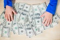 Close-up of hands counting money. Happy child with money dollar, little businessman. Pile of United States dollar hundred USD Royalty Free Stock Photo