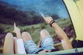Close up of hands couple lover pointing something in tent together,Enjoying camping concept Royalty Free Stock Photo