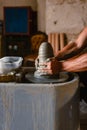 Close-up of the hands of the craftsman while creating a ceramic pot on the lathe Royalty Free Stock Photo