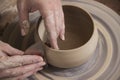Close-up of the hands of a craftsworker ceramist molding a vase Royalty Free Stock Photo
