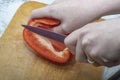 cut red pepper with a knife Royalty Free Stock Photo