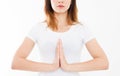 Close-up of hands of cute girl in white tshirt , meditating indoors, focus on arms in Namaste gesture. Asian medicine, yoga Royalty Free Stock Photo