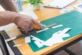 Close up of hands cutting paper