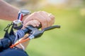 Close up hands dad with his son having fun and riding together on a black electric scooter. Royalty Free Stock Photo