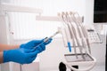 close-up of the hands of a dentist doctor in gloves hold a syringe with an anesthetic. the concept of an injection for a Royalty Free Stock Photo